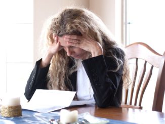 woman worried about bills and debt and foreclosure